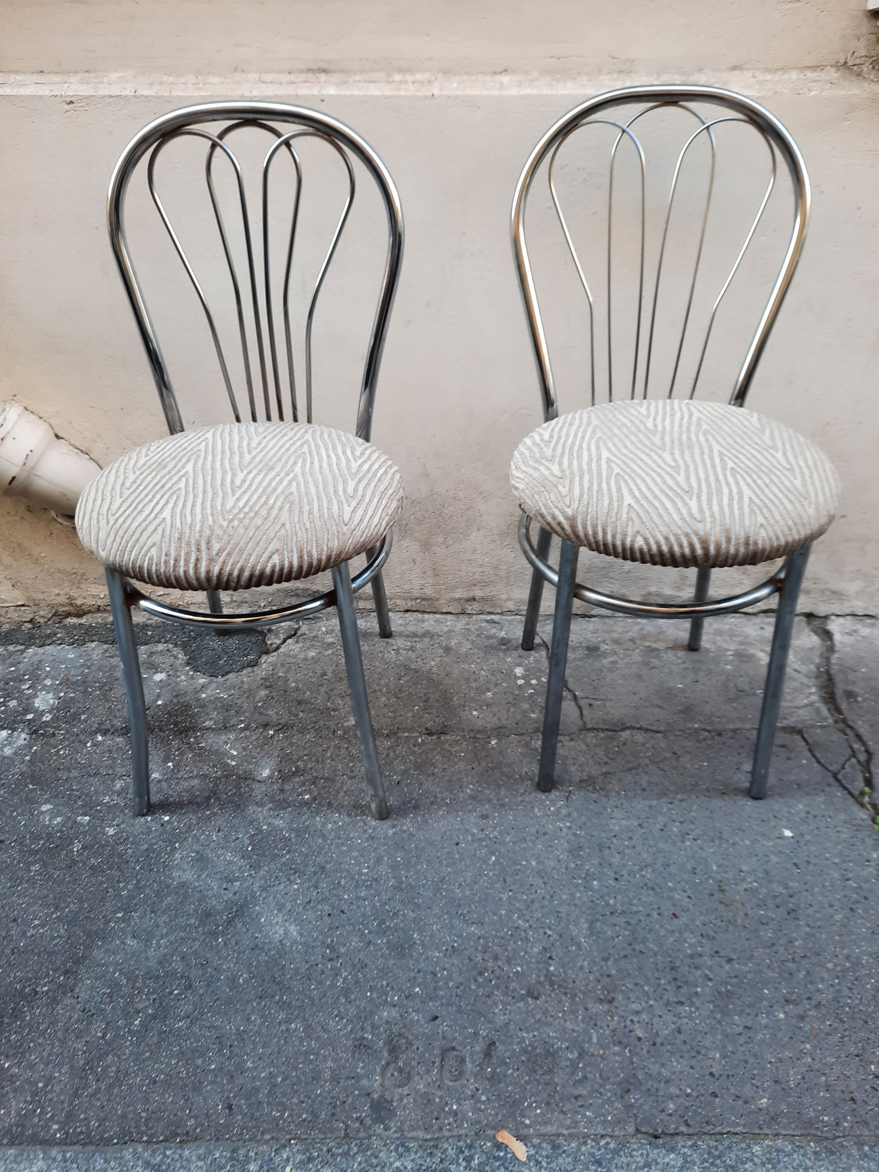 Pair of tubular metal bistro chairs