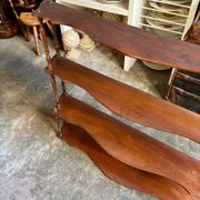 Curved and turned wooden wall shelf