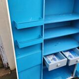 Old industrial metal cabinet in white and blue.