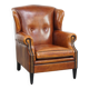Sheepskin wingback armchair with stitching and black piping
