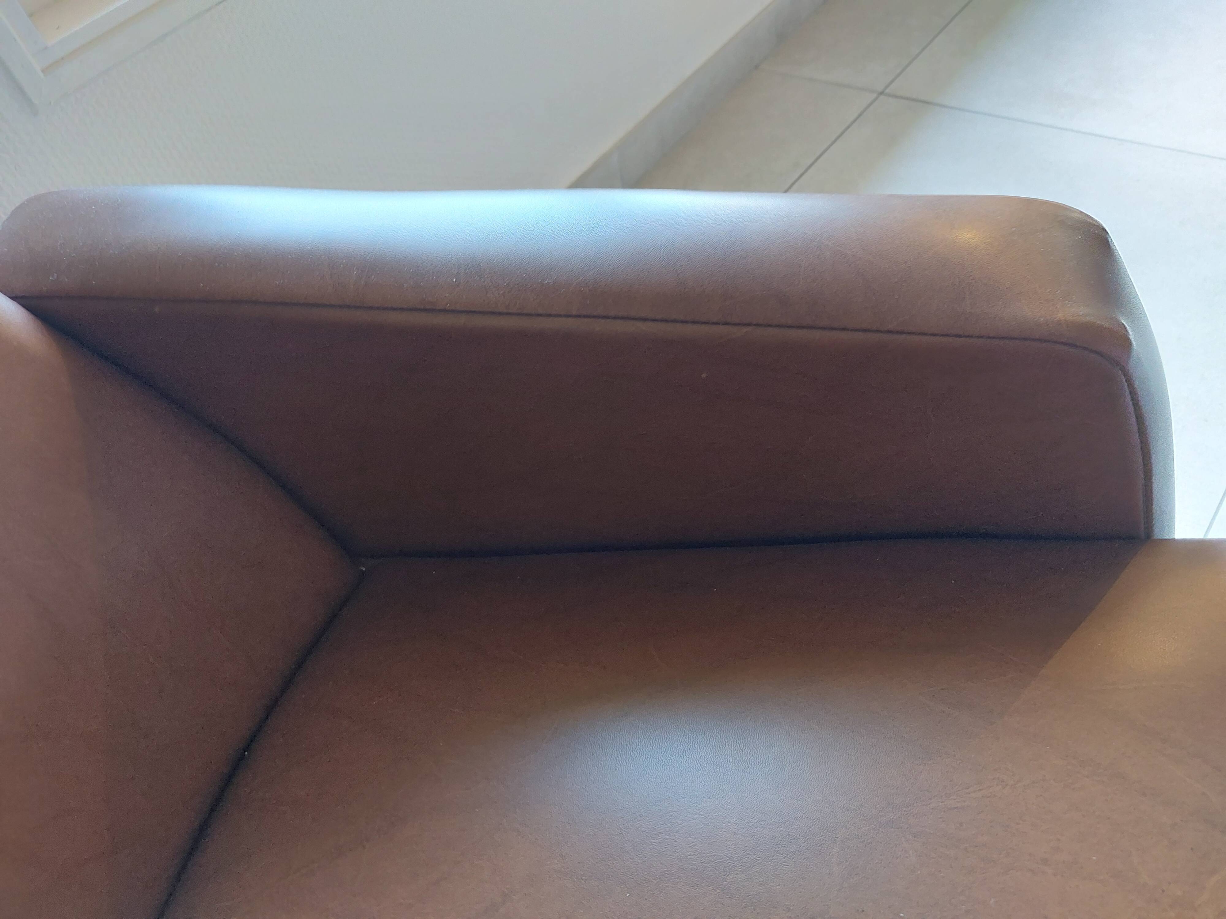 a pair of comfortable vintage armchairs with splayed legs