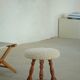 Modern Danish stool, with three oak legs featuring turned feet and a lambswool seat, 1950s.