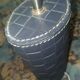 Ovoid lamp sheathed in braided blue leather and saddle stitching