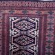 Handmade vintage 1960s Uzbek Bukhara rug – small wool tribal carpet (65cm x 95cm)