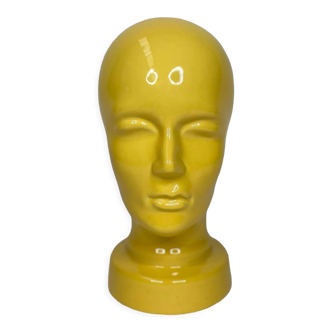 Face statue in glazed ceramic