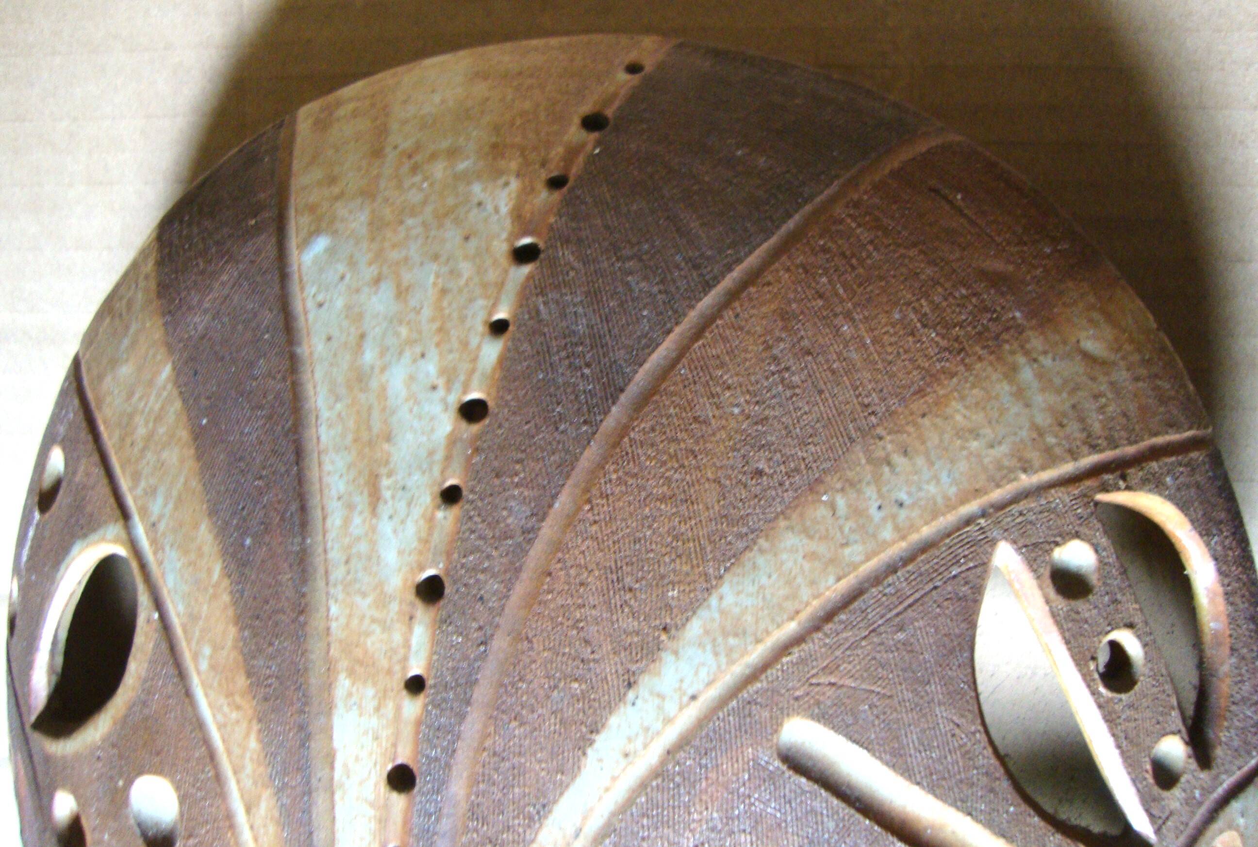 Ethnic ceramic wall lamp signed.