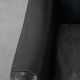 Armchair in black grained cowhide leather with a deep seat