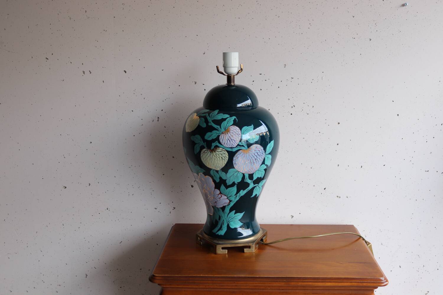 Vintage ceramic lamp with floral decoration.