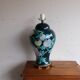 Vintage ceramic lamp with floral decoration.