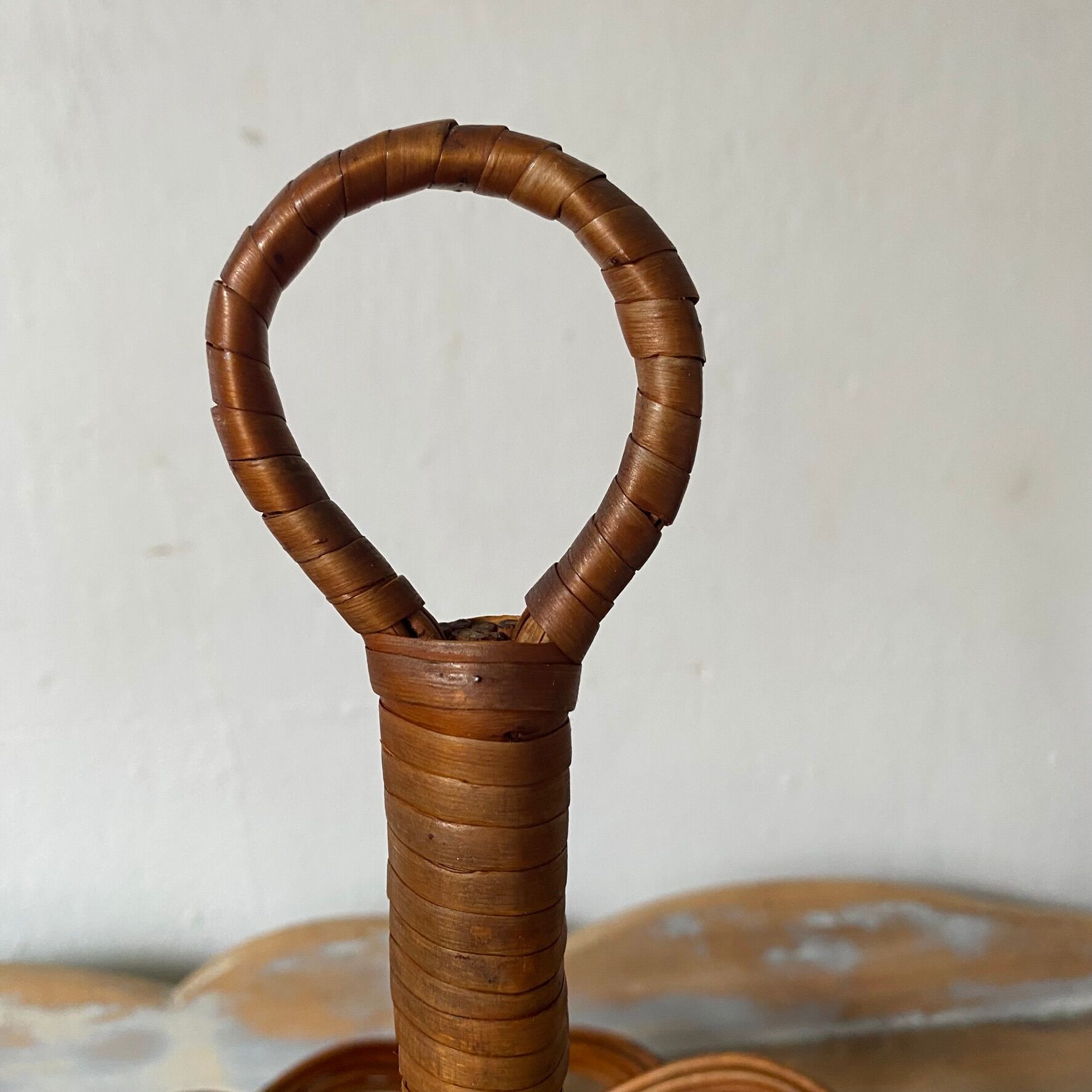 Wicker fruit bowl on a stand