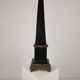Black porcelain obelisk with bronze ornaments