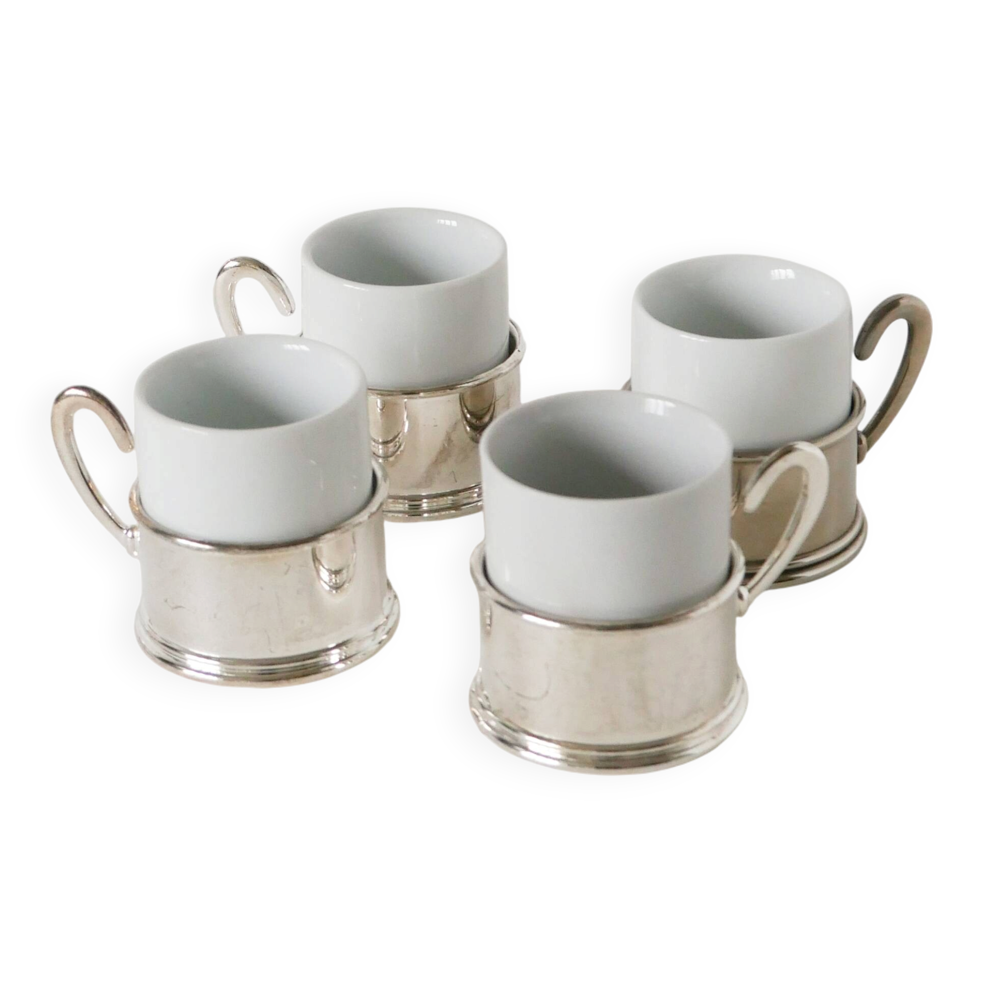 Set of 4 porcelain and silver-plated coffee cups, 1970.