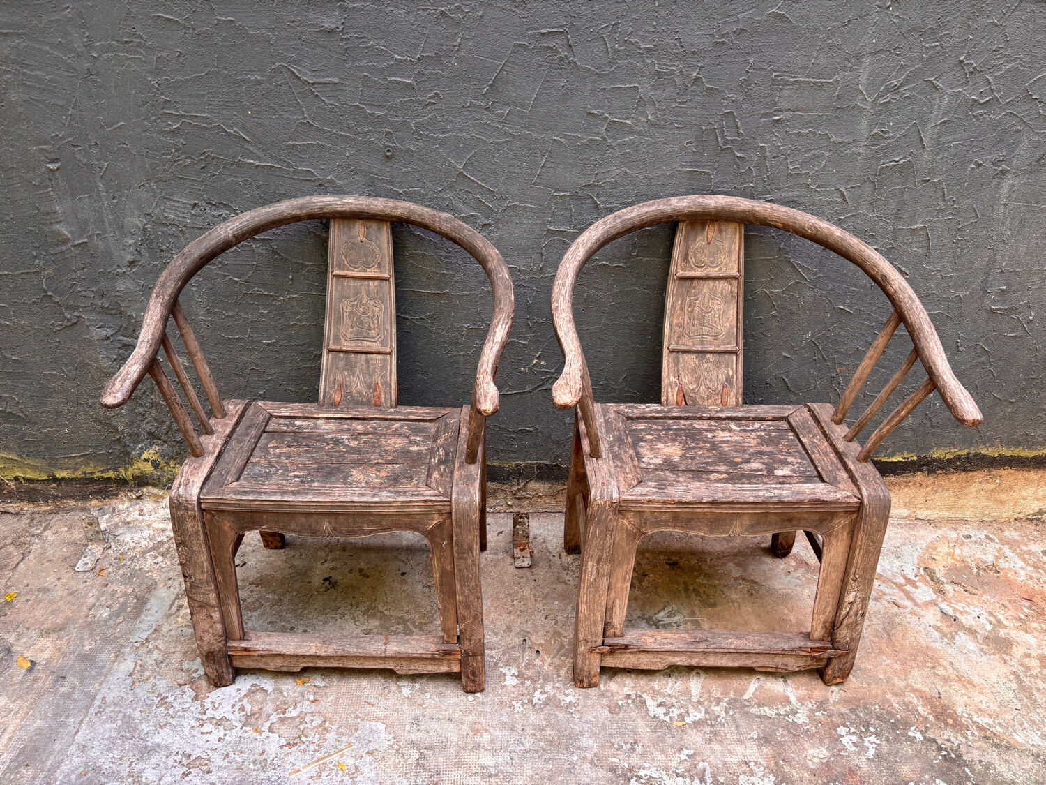 Pair of antique Chinese armchairs in patinated wood