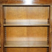 Pair of Sheraton Revival bookcases in satinwood, walnut, and yew.