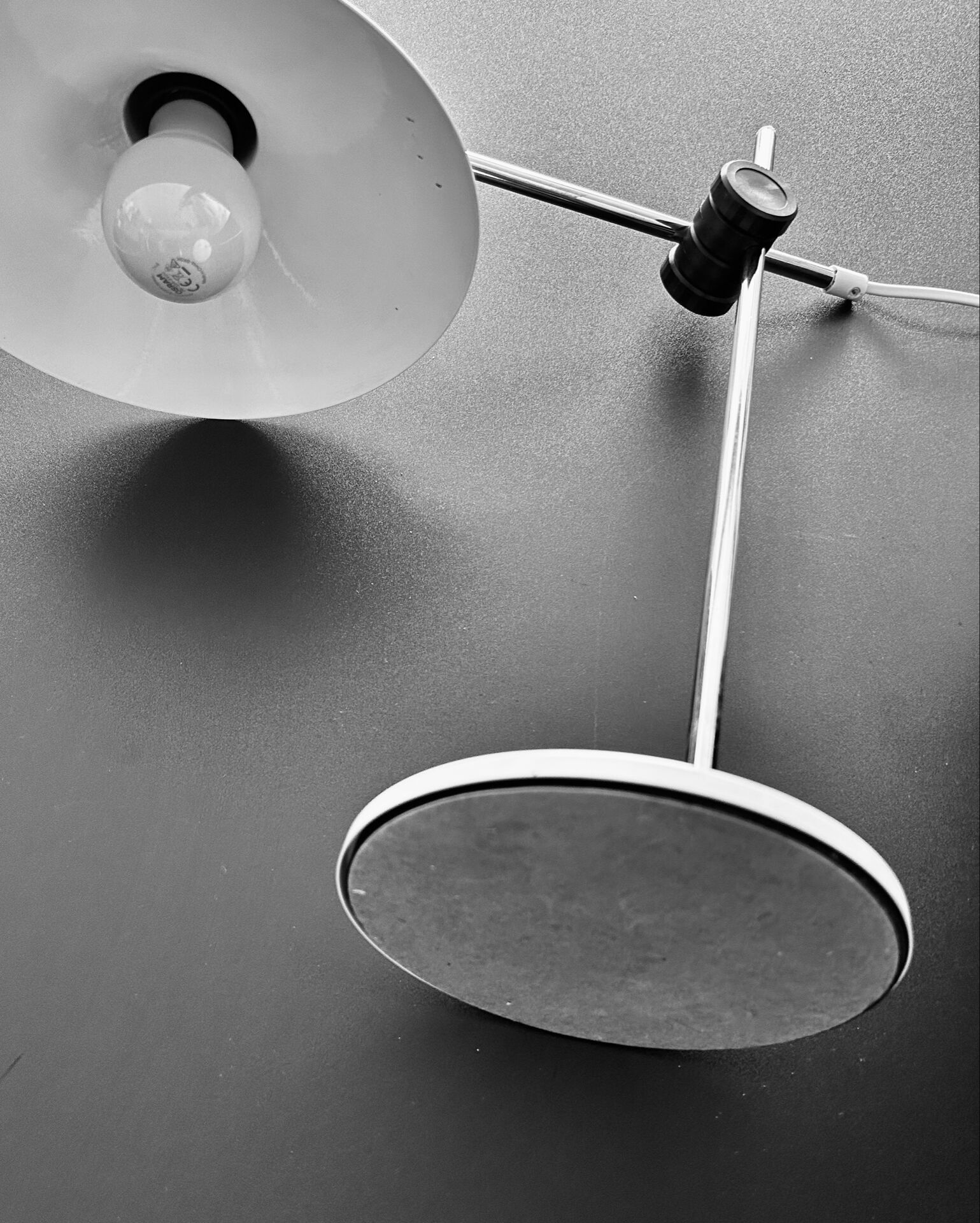 Articulated lamp in white colour.