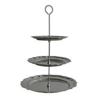 Three-tiered serving trolley in shiny stainless steel.