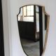 Brass mirror with crest, bead frieze, Italian design style.