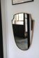 Brass mirror with crest, bead frieze, Italian design style.