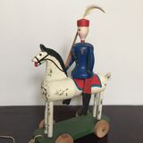 Soldier on wooden horse to shoot