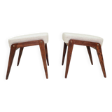 Pair of wooden stools with beige fabric.