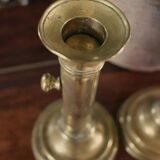 Pair of brass torch candle holders with pushers