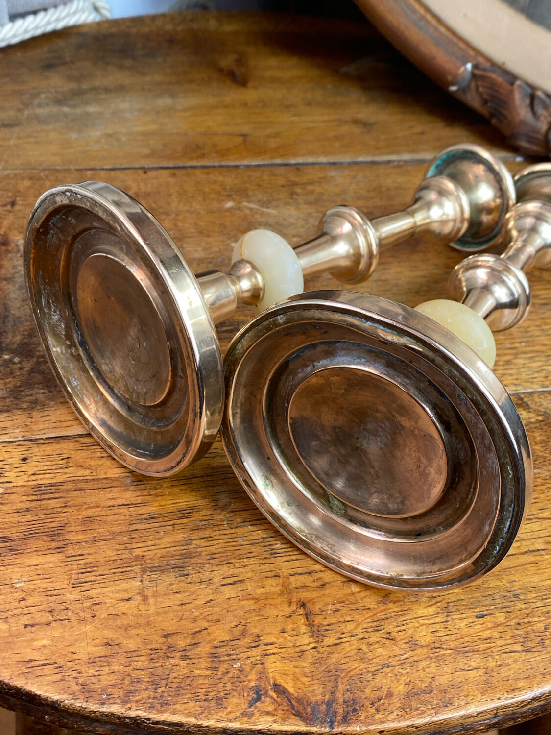 Pair of brass and stone candlesticks