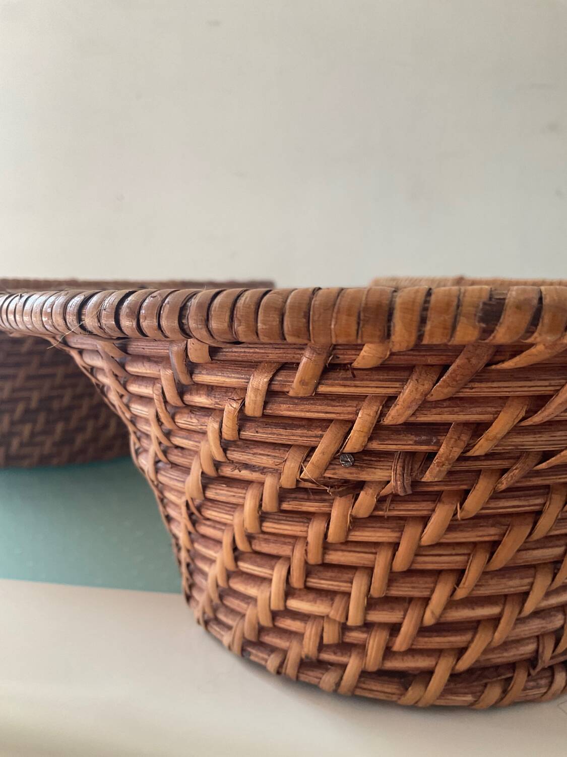 Trio of vintage woven rattan and wicker baskets