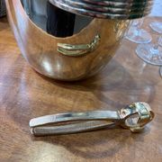 Alpaca champagne bucket from the 1920s with its monopole tongs.