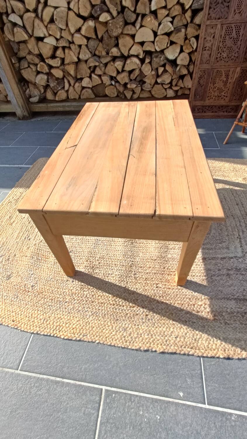 Low farmhouse table in raw wood
