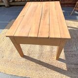 Low farmhouse table in raw wood