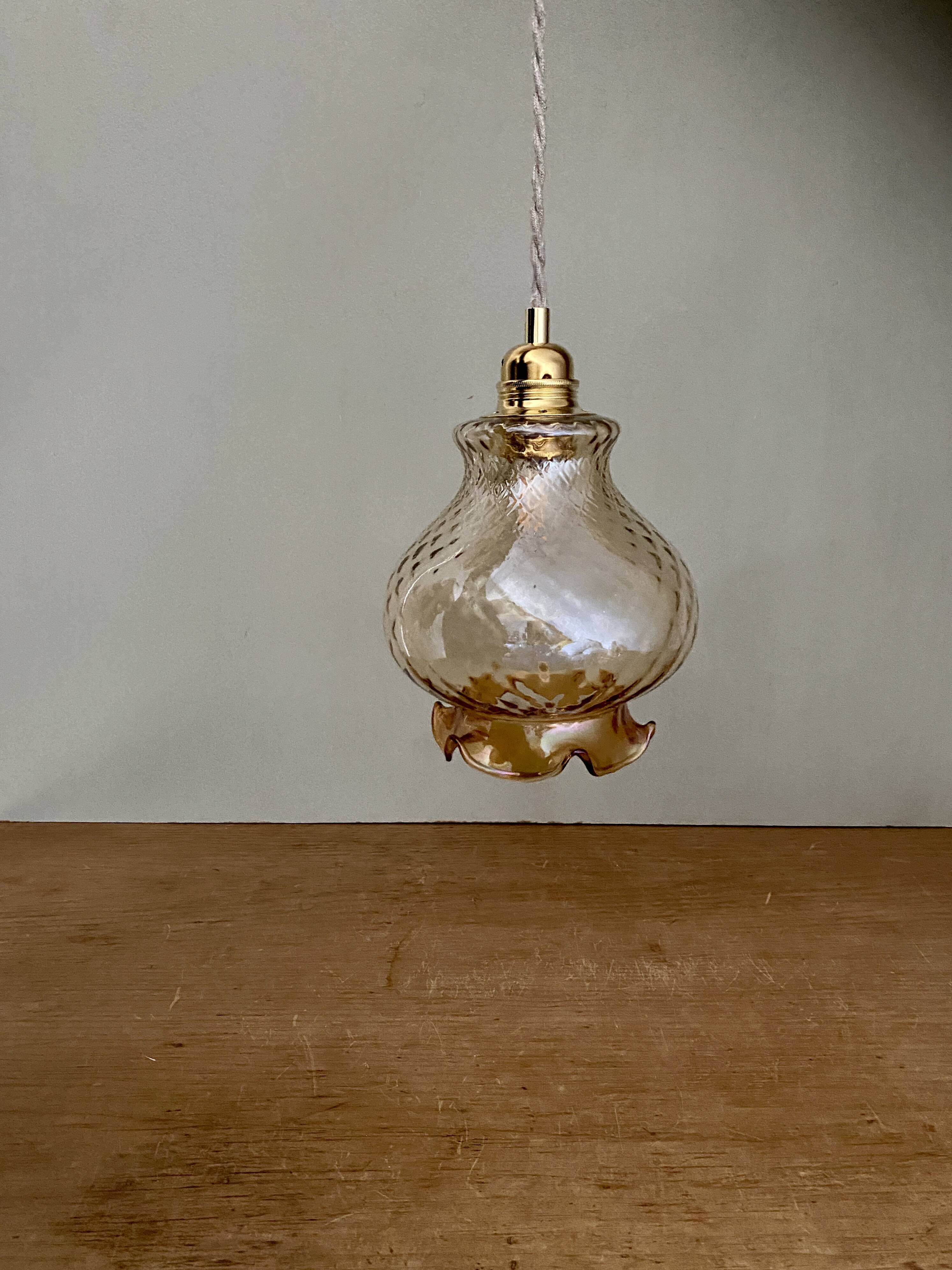 Vintage globe pendant light in amber glass