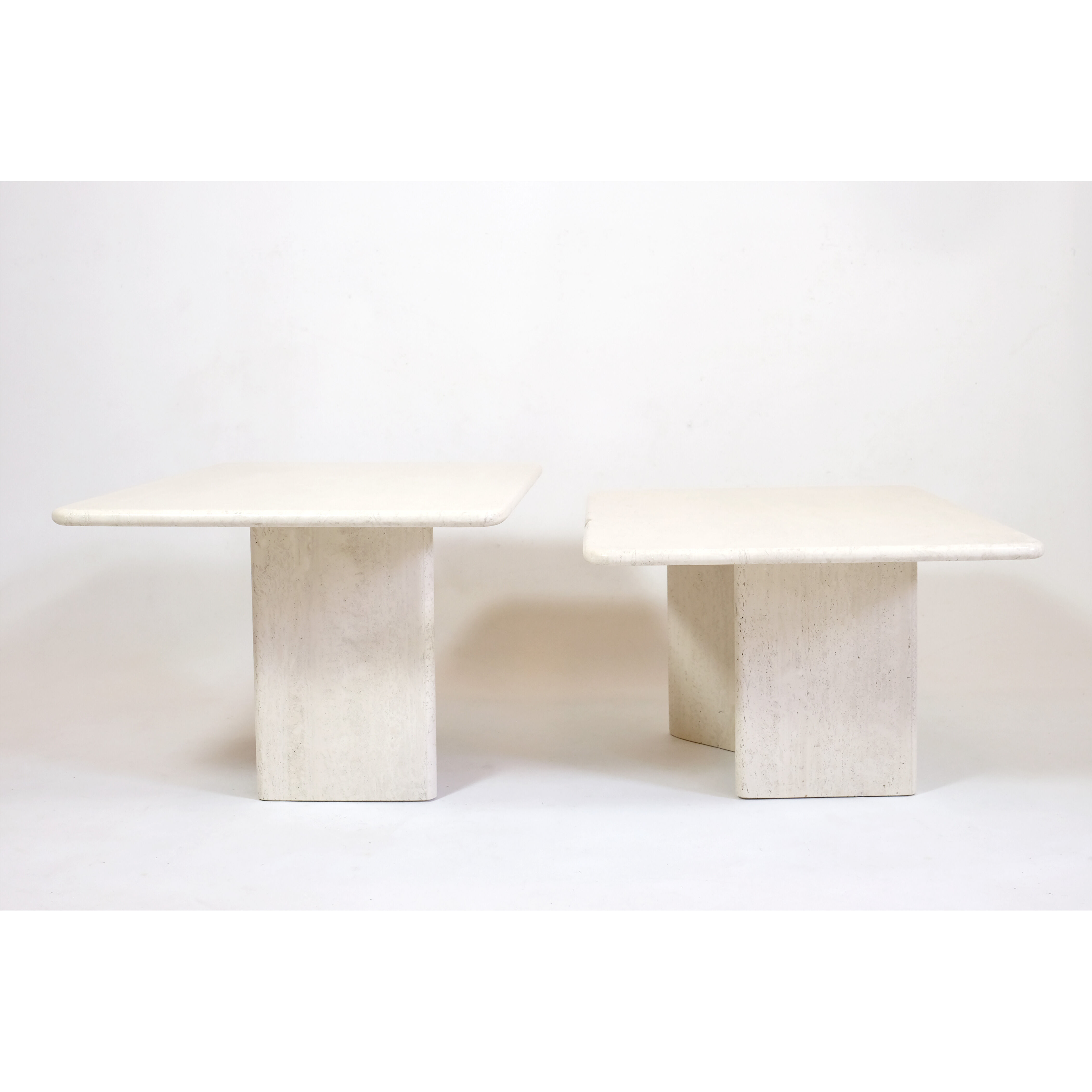 Pair of travertine trundle tables, Italy