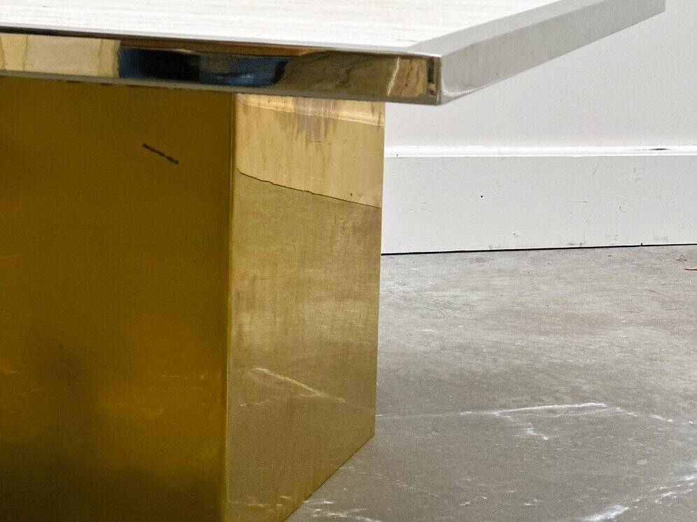 Brute travertine coffee table with brass base and chrome edges, France 1970s.