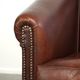 Characterful sheepskin club armchair in a dark cognac colour in English style