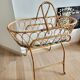 Rattan bassinet with support