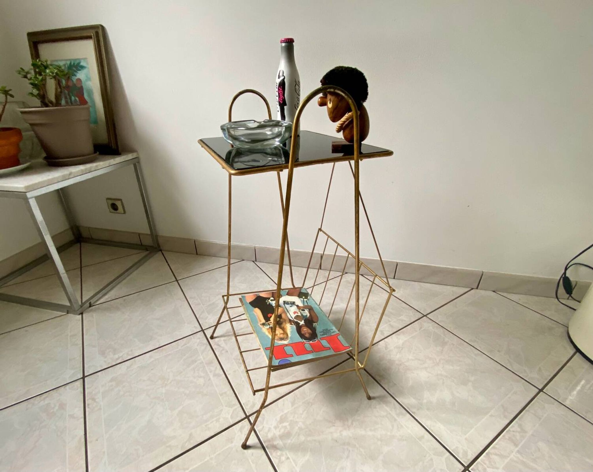 Vintage 1960s brass and smoked glass side table with magazine holder.