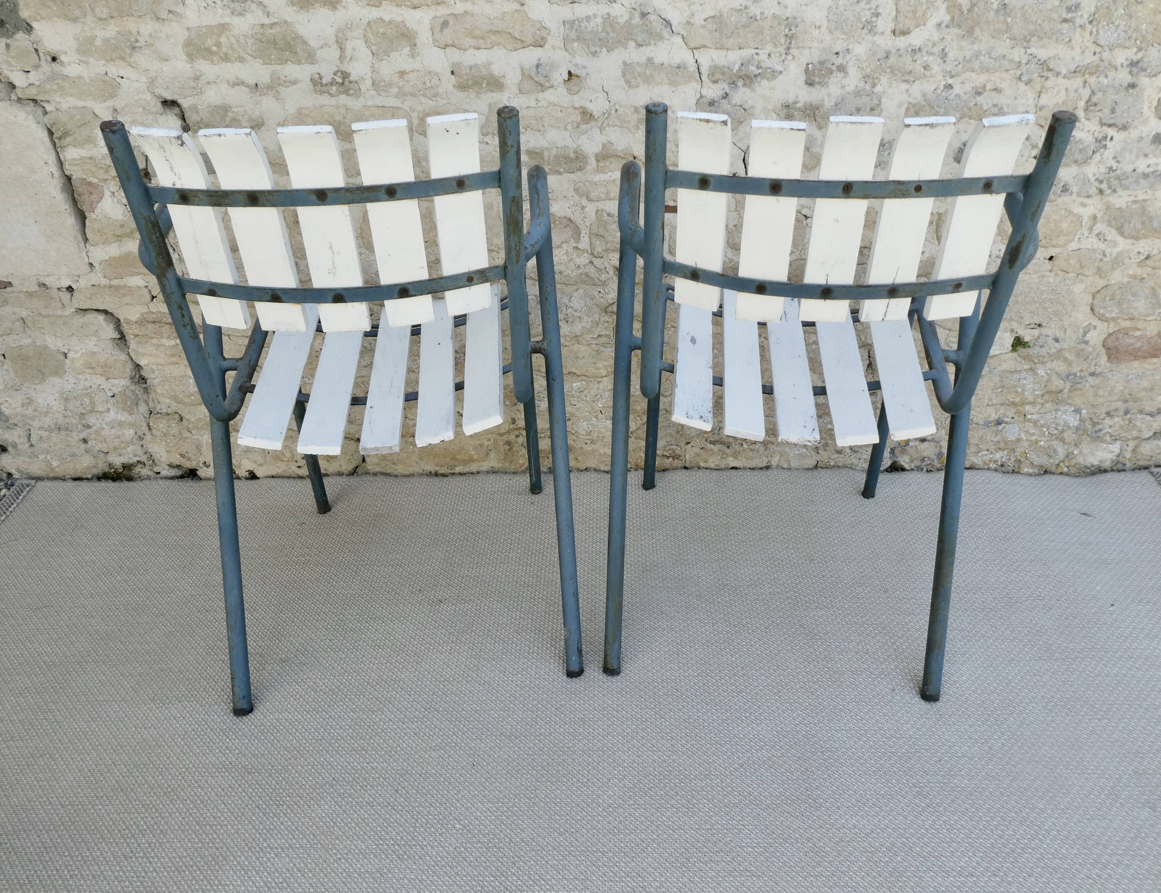 Pair of wooden and metal armchairs from the 60s