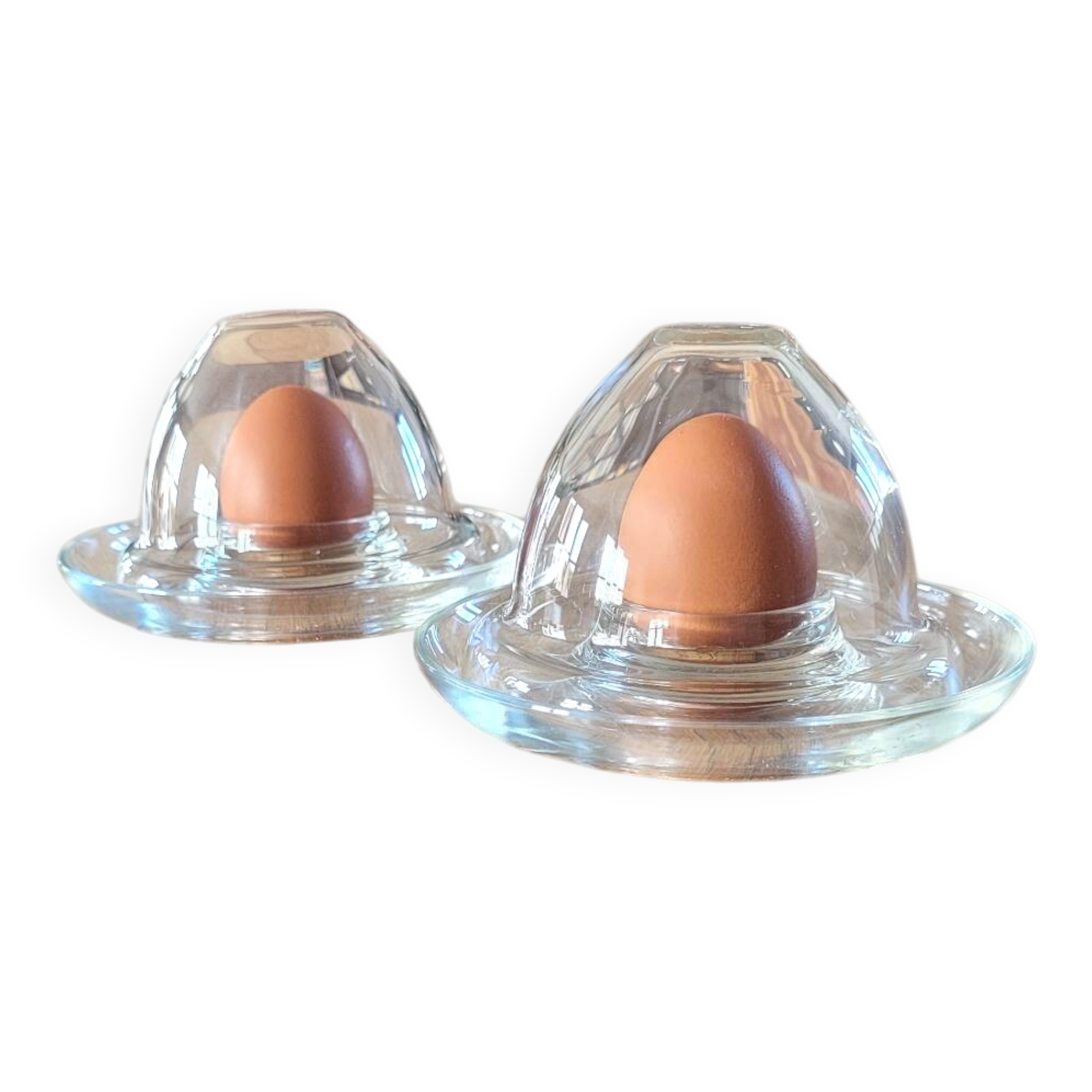 2 egg cups with matching glass cloches in transparent glass