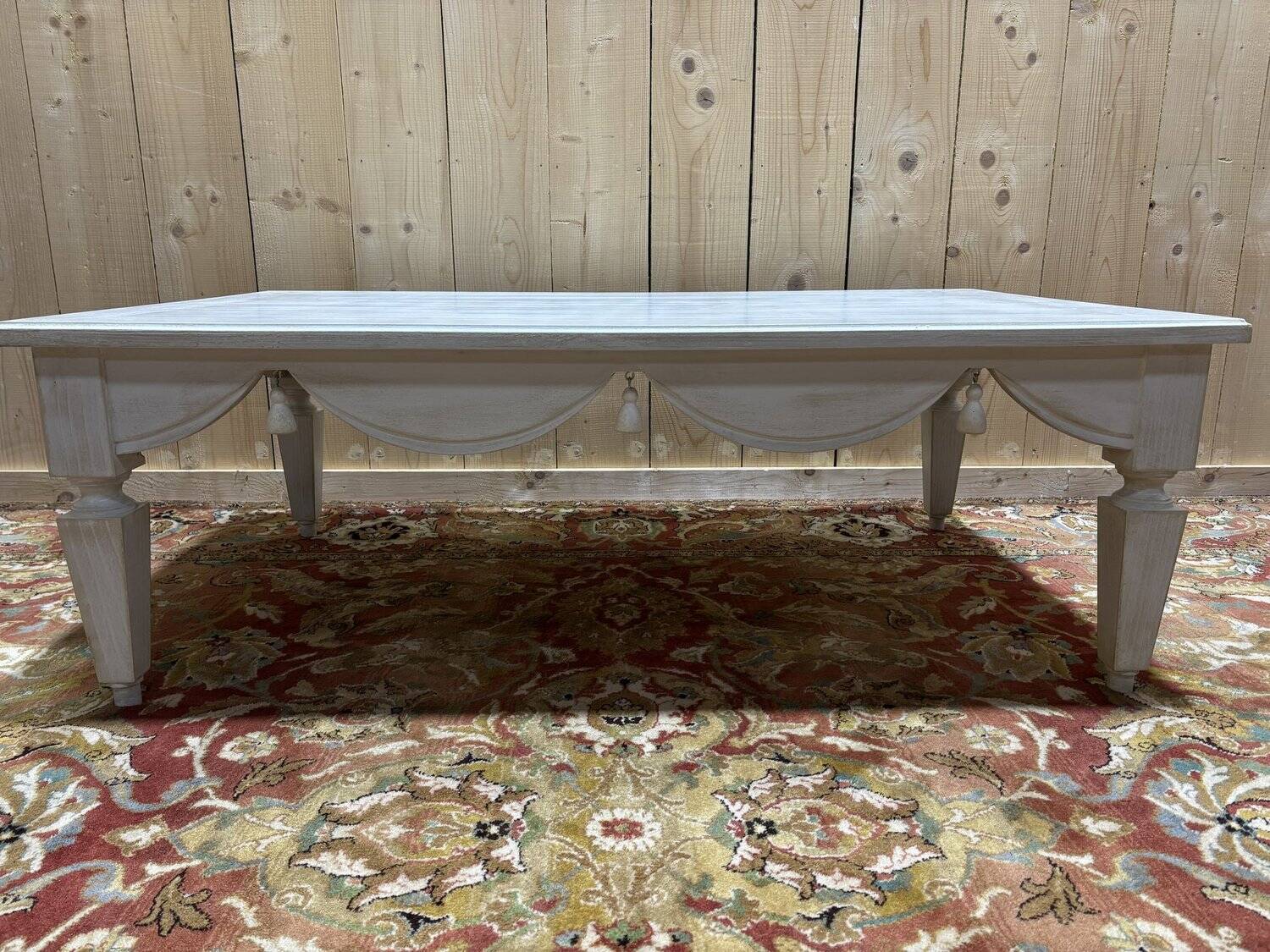 Painted wood coffee table with a distressed finish.