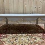 Painted wood coffee table with a distressed finish.