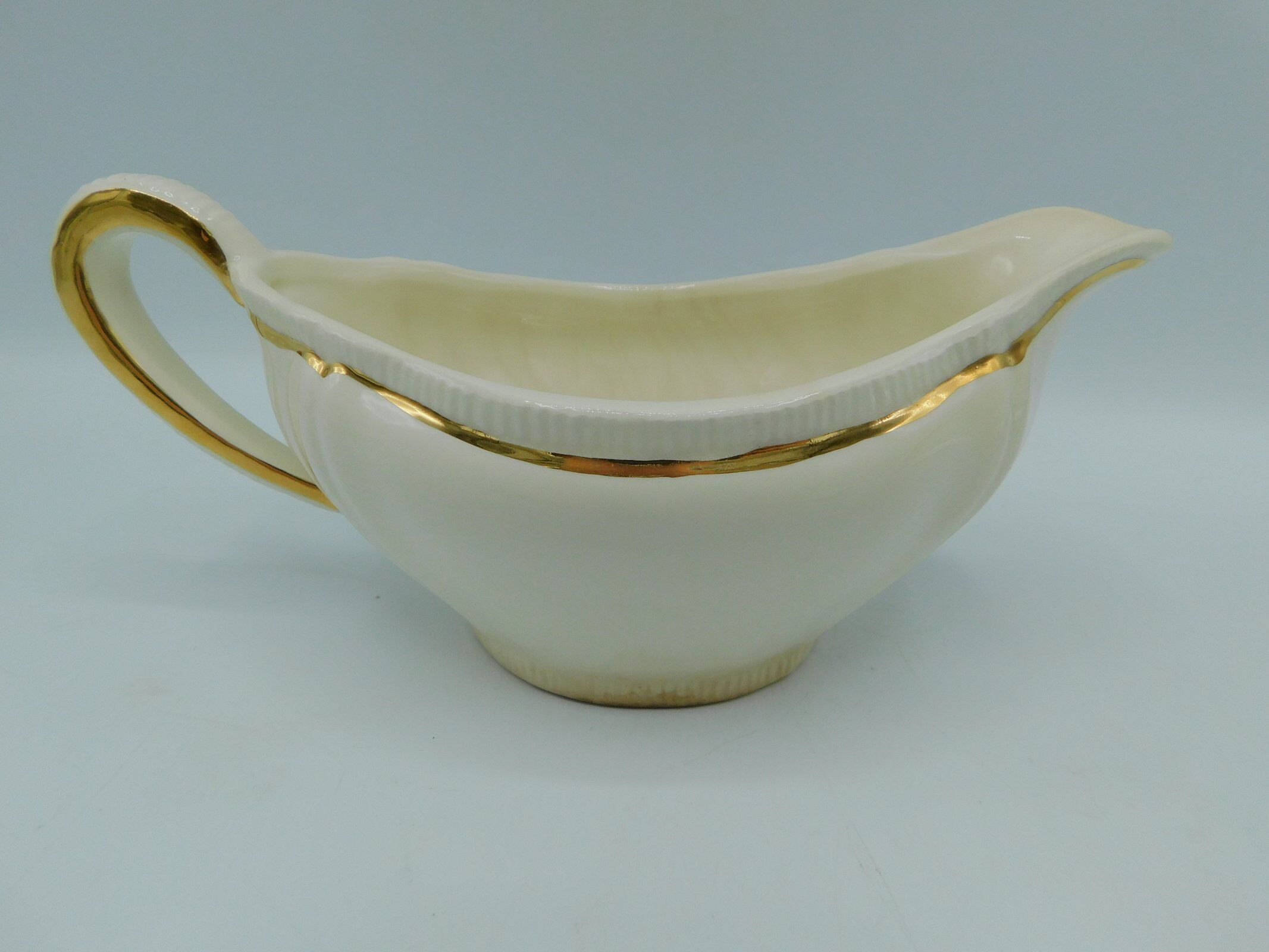 Longchamp ivory and gold saucière