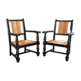 Pair of vintage 1950s Neo-Basque oak armchairs with straw seats and backs.