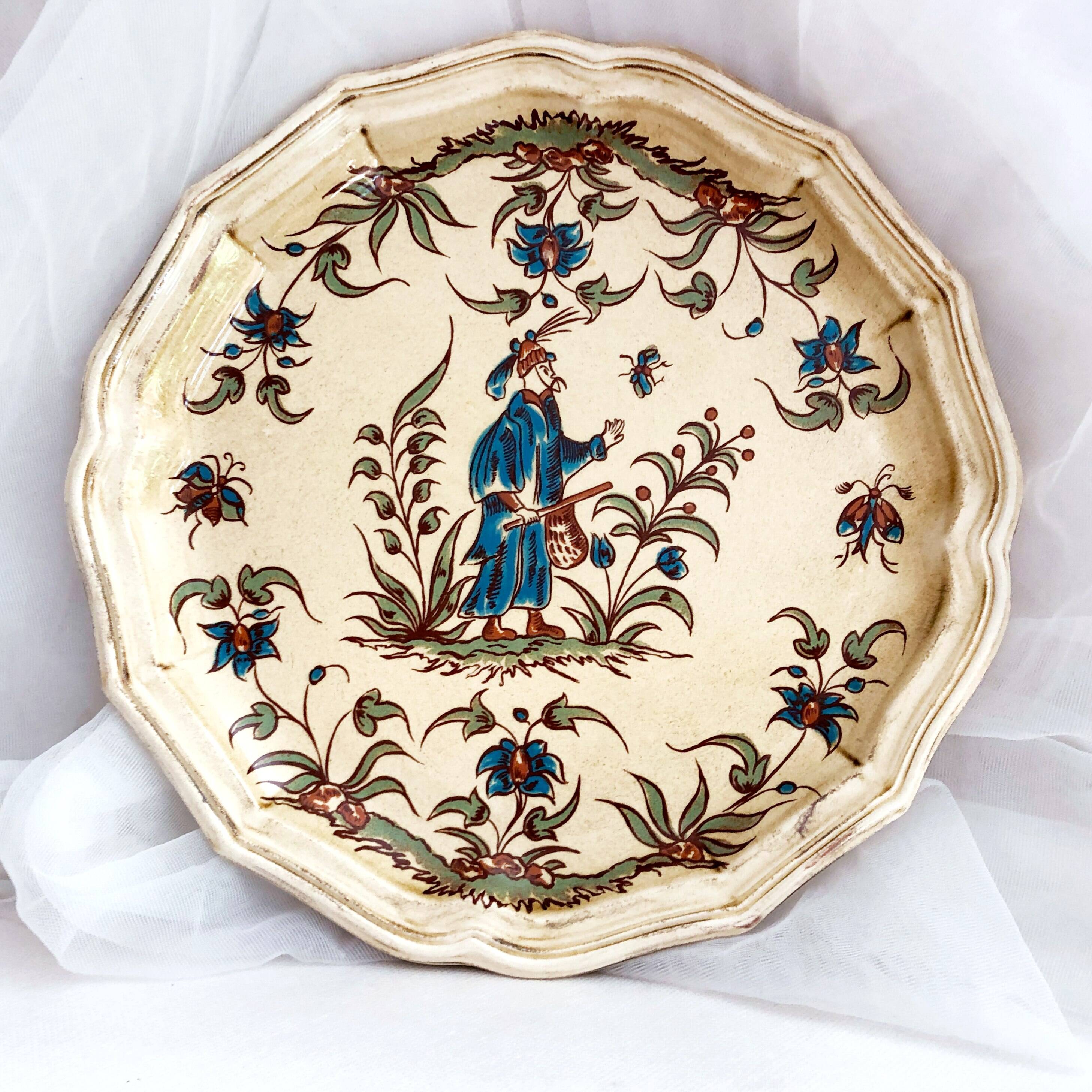 Decorative earthenware plate from Salins France, Moustiers decor, 25.5 cm