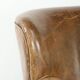 Robust cowhide armchair in a beautifully subtle size with a wonderful patina.
