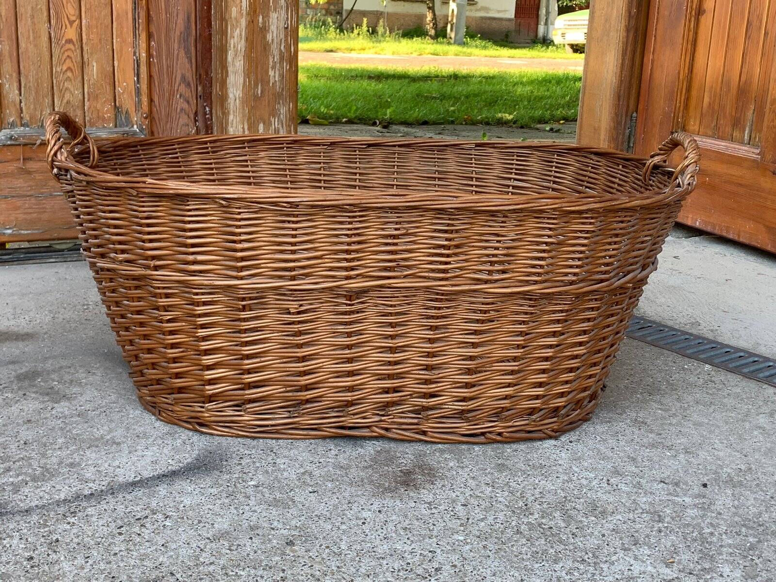 Rustic brown wicker basket from the 1940s — large oval laundry basket 68 x 45 cm