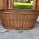 Rustic brown wicker basket from the 1940s — large oval laundry basket 68 x 45 cm