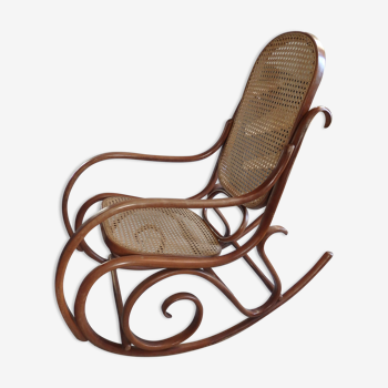 Rocking-chair in turned wood and cannage