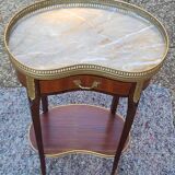 Louis XVI period pedestal table, in solid mahogany and veneer, and in gilded bronze.