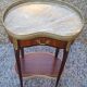 Louis XVI period pedestal table, in solid mahogany and veneer, and in gilded bronze.