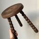 Wooden stool with three twisted legs